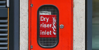 Dry riser inlet box for firefighters